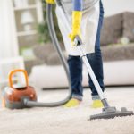 Housewife,From,Cleaning,Service,Cleans,Carpet,With,Vacuum,Cleaner