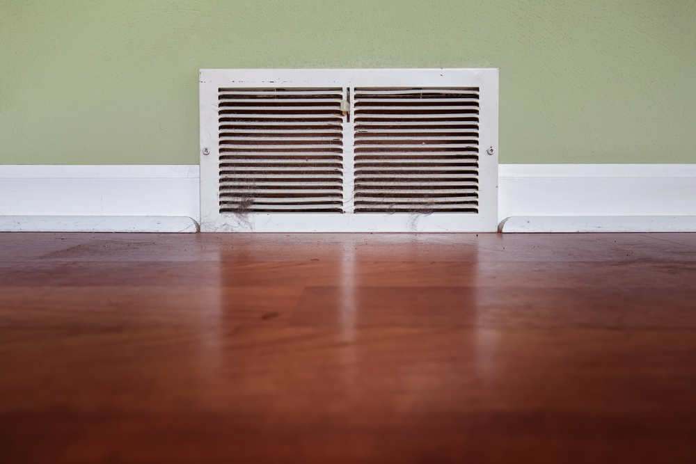 Dirty,Register,Wall,Vent,With,Dust,And,Pet,Hair,Clogging