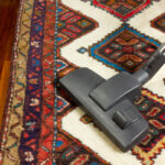 Close-up,Of,A,Vacuum,Cleaner,On,An,Oriental,Carpet