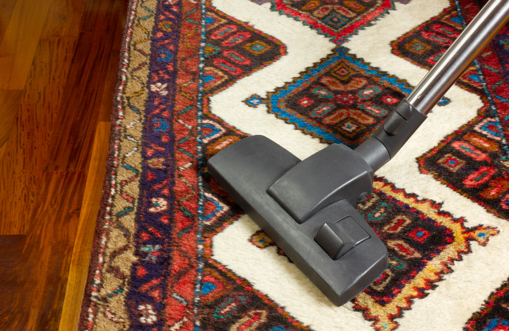 Close-up,Of,A,Vacuum,Cleaner,On,An,Oriental,Carpet