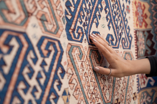 Young,Woman,Touching,The,Traditional,Turkish,Carpet.traditional,Culture,Products.