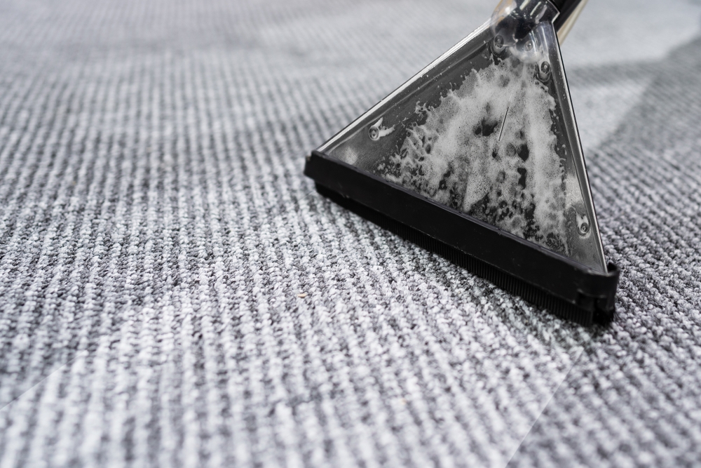 Photo,Of,Janitor,Cleaning,Carpet,With,Vacuum,Cleaner